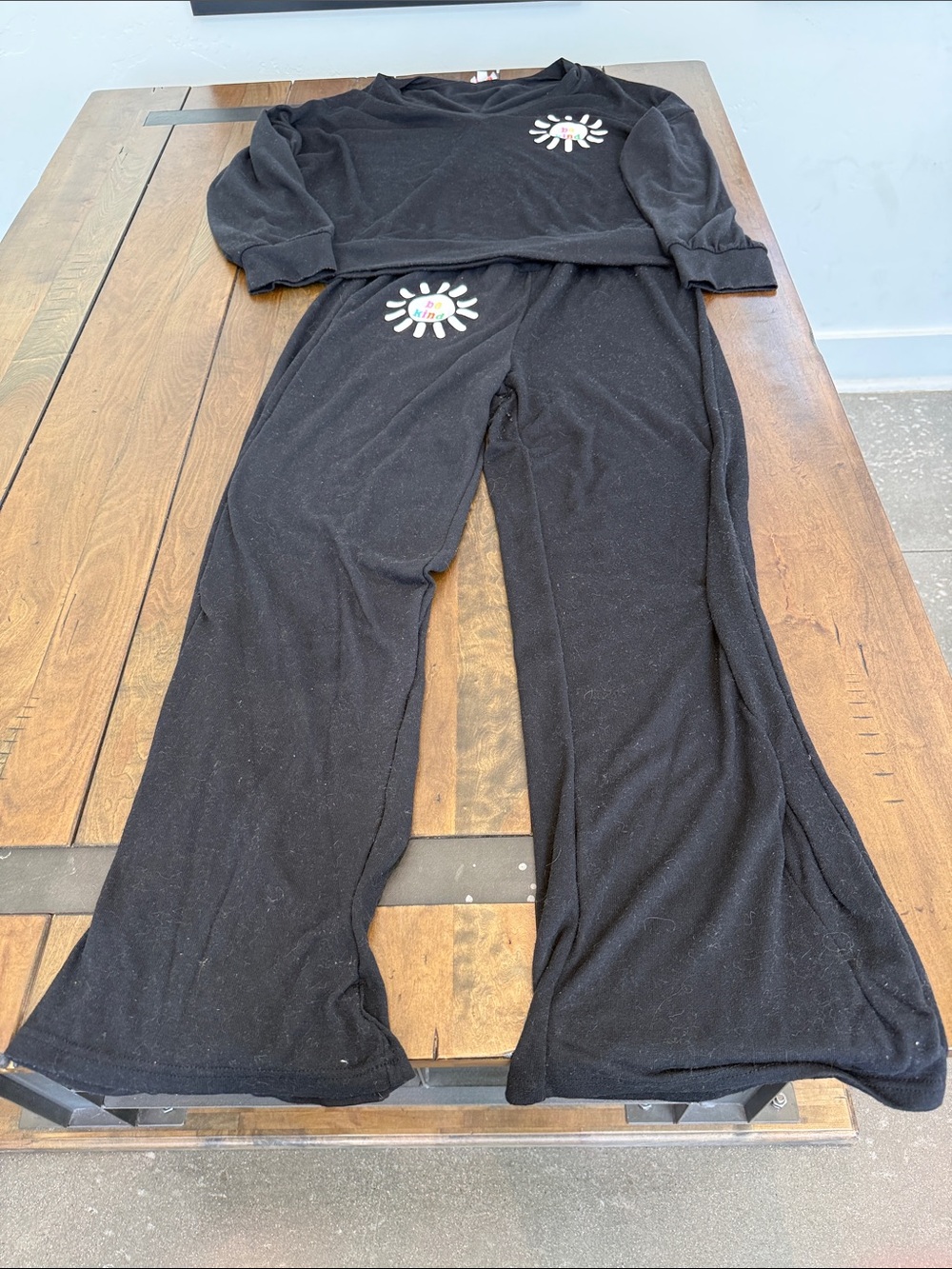 Sunshine Sisters Cozy Black Women’s Pajama Set with Sunburst Graphic-Be Kind